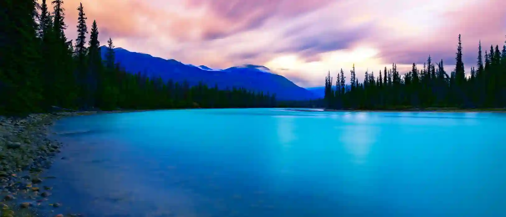 Beautiful pastel skies and blue lake gives the feeling of peace like TMS therapy can do for you.